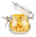 Dried italian pasta snail Pipe rigate in a open transparent glass jar with rubber seal and metal clamp on lid isolated on white Royalty Free Stock Photo