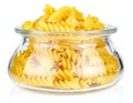 Dried italian pasta spiral Fusilli in a open transparent glass oval storage jar isolated on white background Royalty Free Stock Photo