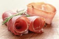 Dried jamon slices on wood table, spanish food