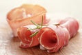 Dried jamon slices on wood table, spanish food Royalty Free Stock Photo