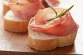 Dried jamon slices on wood table, spanish food