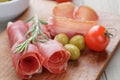 Dried jamon slices on wood table Royalty Free Stock Photo