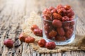 Dried Jujube, Chinese dried red date fruit in glass cup on old wood background