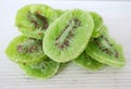 Dried kiwi fruit on white wooden background Royalty Free Stock Photo