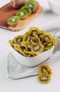 Dried kiwi slices in a white ceramic bowl Royalty Free Stock Photo