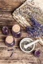 Dried lavender flowers in a in a mortar and pestle with bottle of essential lavender oil or infused water Royalty Free Stock Photo