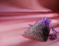 Dried lavender herbs for for relaxing sleep on pink background Royalty Free Stock Photo