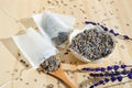 Dried lavender, spoon and tea bag sachet on wooden table. Organic flower herbal drink. Zero waste wrapper. Royalty Free Stock Photo