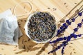 Dried lavender and tea bag sachet on wooden table. Organic flower herbal drink. Zero waste wrapper Royalty Free Stock Photo