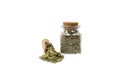 Dried leaves o Lemon verbena in latin Aloysia citrodora in wooden scoop and glass jar on isolated on white background.