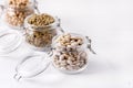Dried Lentils Chickpeas White beans in Glass Jars on White Wooden Background Copy Space Royalty Free Stock Photo