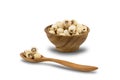 Dried Lotus Seeds in wooden bowl and wooden spoon on white background Royalty Free Stock Photo