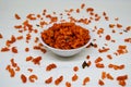 Savory and crunchy spicy macaroni in a bowl on a white background.