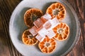 Dried mandarin or tangerine slices with mandarin flavored Turkish delight on a wooden table. Seferihisar local flavors. Dried