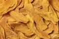 Dried mango chips close up full frame as background Royalty Free Stock Photo