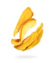Dried mango close up in the air on a white background Royalty Free Stock Photo