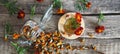 Dried marigold flowers with medicinal herbal tea on a wooden background. The use of flowers Chernobrovtsy or Mary is Gold in folk Royalty Free Stock Photo