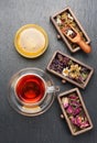 Dried medicinal herbs in wooden boxes and herbal healing tea, Royalty Free Stock Photo