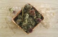 Dried Milk Thistle Herb in a Wicker Basket with Seeds