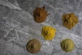 Dried mixed organic spice powders on a marble kitchen worktop background photographed from above Royalty Free Stock Photo