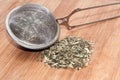 DRIED NETTLE TEA METAL TEA STRAINER Royalty Free Stock Photo