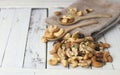 Dried nuts - cashew, almond,walnut and berry on white wooden table