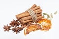 Dried orange, anise stars and cinnamon sticks isolated on white background Royalty Free Stock Photo