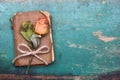 Dried orange roses and old book on wooden background, Royalty Free Stock Photo