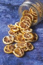 Dried Orange Slices Falling Inside From a Jar