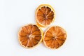 Dried orange slices on white background.