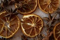 Dried orange star anise cinnamon close-up. Aniseeds, pimpinella anisum, cinnamon sticks and dried slices of an orange