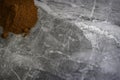 Dried organic smoked paprika powder on a marble kitchen worktop background photographed from above