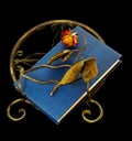 Dried-out rose on book and book stand Royalty Free Stock Photo