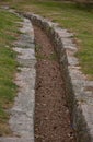 A dried out stream. Gravel with stones on the sides Royalty Free Stock Photo