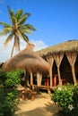 Dried Palm Leaves Thatched Roof Pavilion and Sunshade on the Tropical Beach Royalty Free Stock Photo