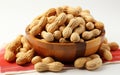 Dried peanuts in peel on bowl closeup isolated on white background Royalty Free Stock Photo