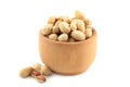 Dried peanuts in wooden bowl isolated on white background Royalty Free Stock Photo