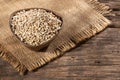 Dried pearl barley in a wooden bowl - Hordeum vulgare Royalty Free Stock Photo