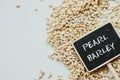 Dried pearled barley closeup and chalkboard Royalty Free Stock Photo