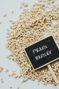 Dried pearled barley closeup and chalkboard Royalty Free Stock Photo