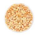 Dried peas in round plate isolated on a white background top view close up Royalty Free Stock Photo
