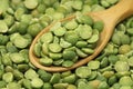 Dried peas in a wooden spoon