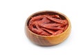 Dried pepper chillies in wooden bowl on white background