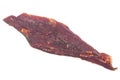 Dried peppered beef jerky piece isolated on white background Royalty Free Stock Photo