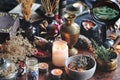 Dried plants, herbs and yellow rose flower petals in a grey, dirty clay pot