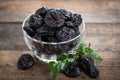 Dried plums - prunes in the bowl Royalty Free Stock Photo