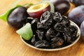 Dried plums prunes and fresh berries