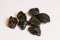 Dried plums - prunes on white background.