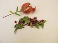 Dried pomegranate leaves, pomegranate flowers and a pomegranate