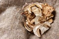 dried porcini mushrooms on sackcloth. Top view Royalty Free Stock Photo
